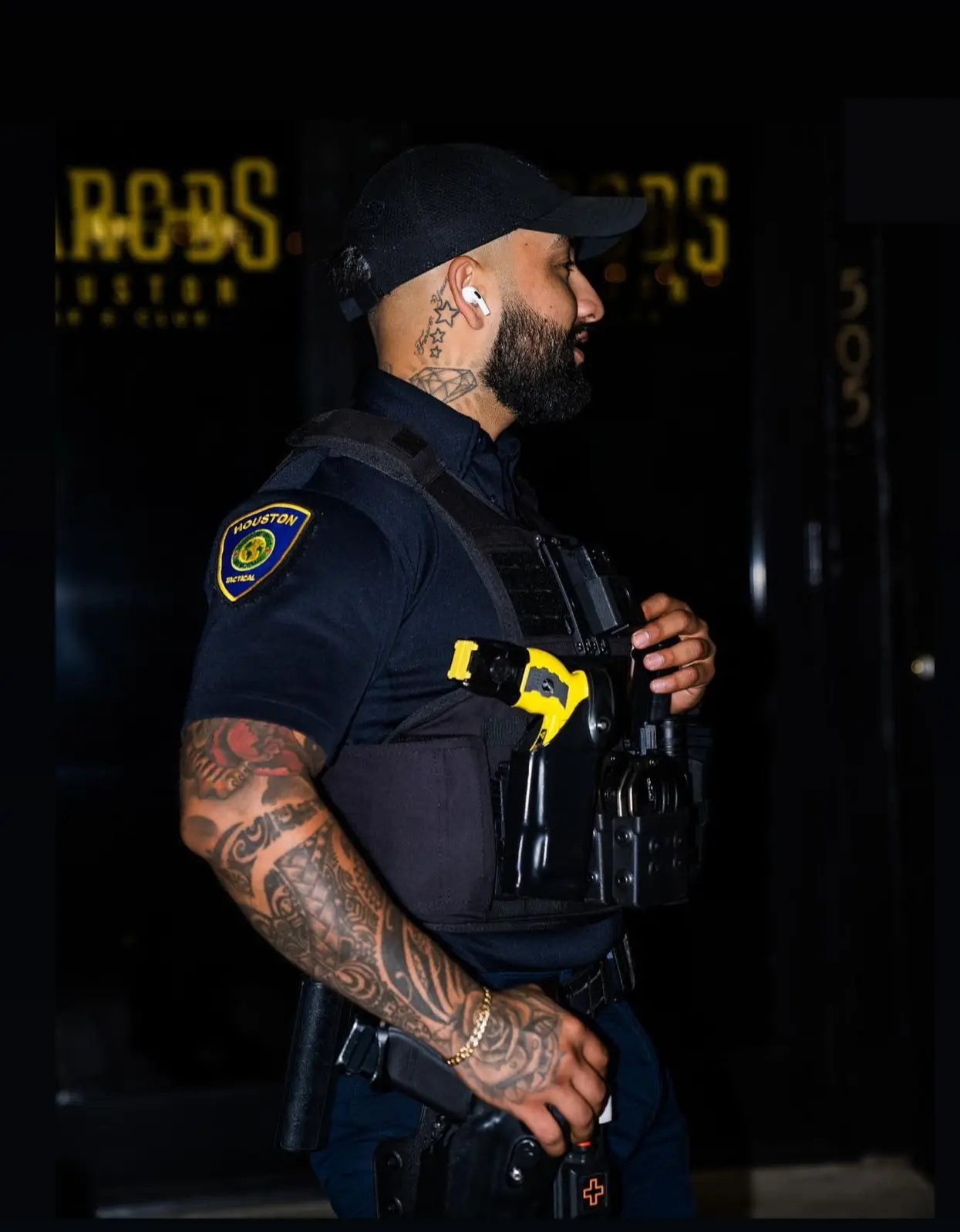 Houston Tactical Agency officer on a night post