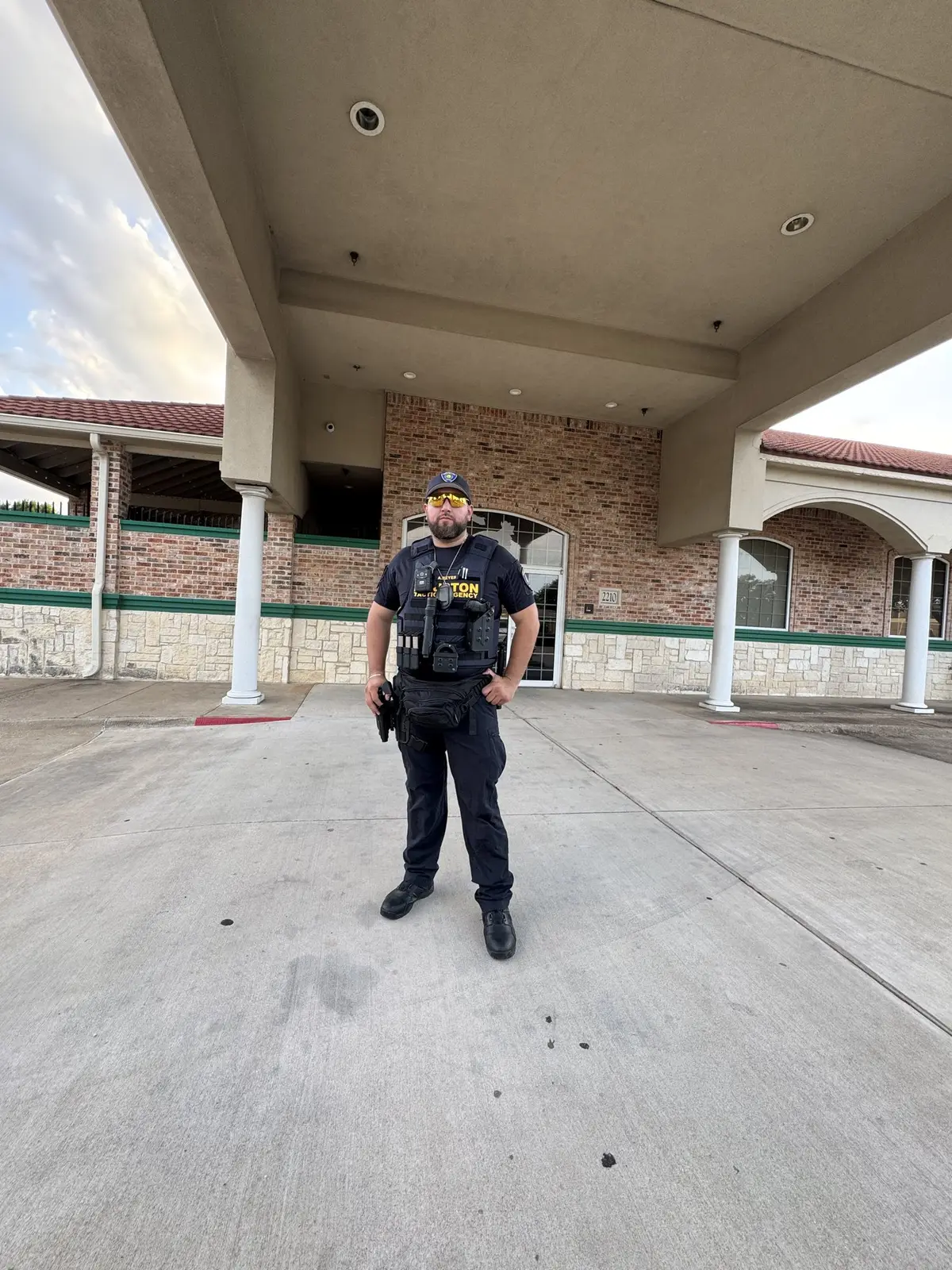 Houston Tactical Agency officer standing a Houston post